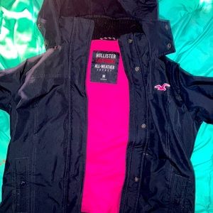 Hollister Coat. Dark Blue outside with pink emblem & the inside’s pink.size M